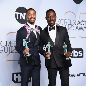 Michael B. Jordan and Sterling K. Brown pose in the press room with award
